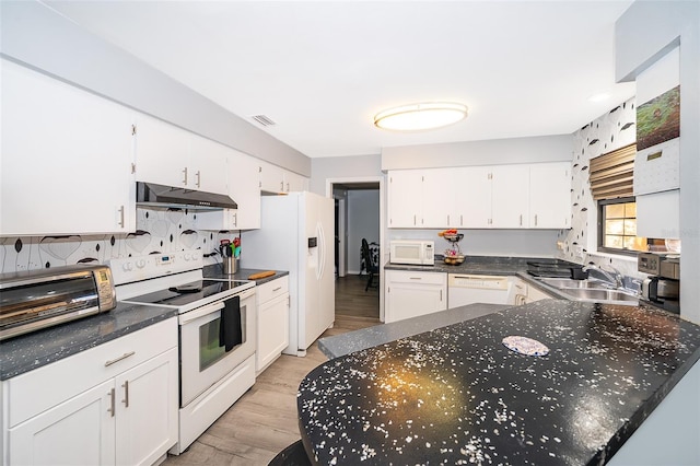 1608 Bomi Cir, Winter Park, FL 32792 - kitchen featuring white appliances, under cabinet range hood, white cabinets, and light wood-style flooring