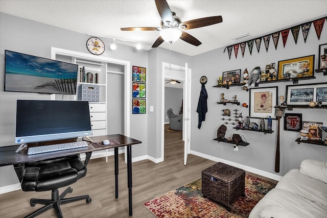 1608 Bomi Cir, Winter Park, FL 32792 - office space featuring a ceiling fan, a textured ceiling, wood finished floors, and baseboards