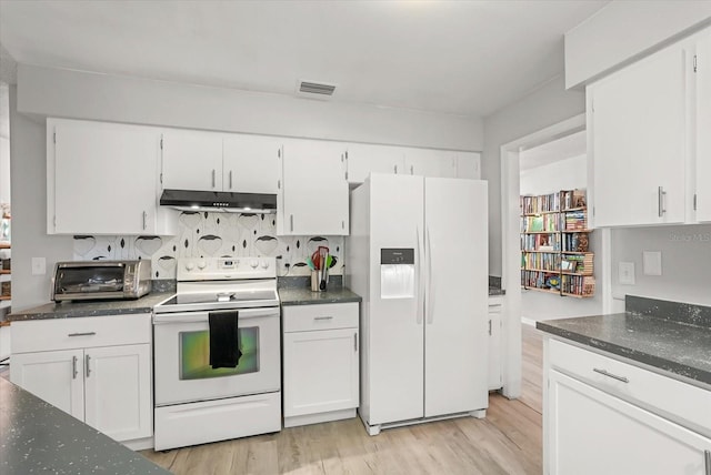 1608 Bomi Cir, Winter Park, FL 32792 - kitchen with white appliances, under cabinet range hood, and white cabinetry