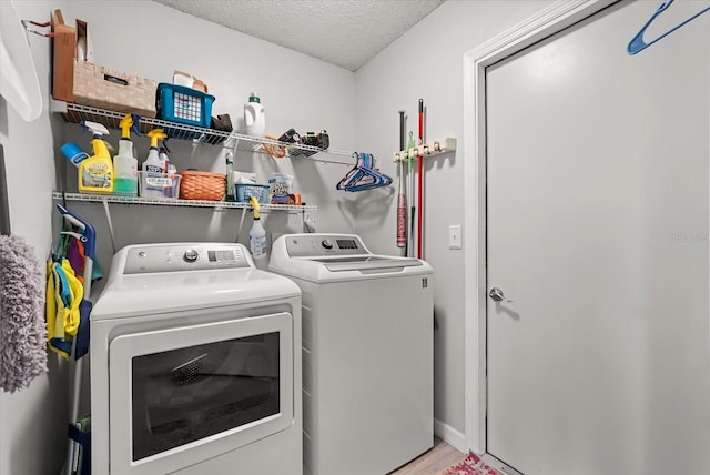 1608 Bomi Cir, Winter Park, FL 32792 - laundry room with washer and clothes dryer, a textured ceiling, and wood finished floors