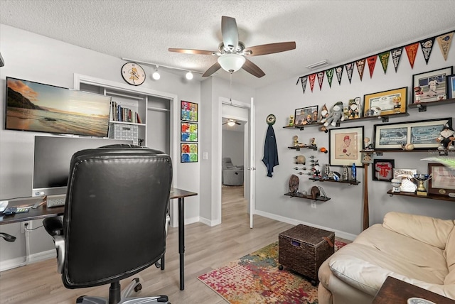 1608 Bomi Cir, Winter Park, FL 32792 - office featuring a ceiling fan, wood finished floors, and a textured ceiling