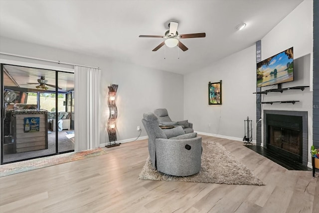1608 Bomi Cir, Winter Park, FL 32792 - living area with a ceiling fan, wood finished floors, a large fireplace, and vaulted ceiling