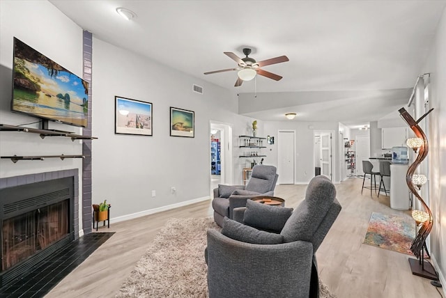 1608 Bomi Cir, Winter Park, FL 32792 - living area with a ceiling fan, wood finished floors, and a fireplace