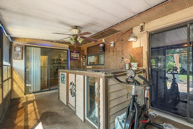 1608 Bomi Cir, Winter Park, FL 32792 - bar area with a ceiling fan and concrete flooring