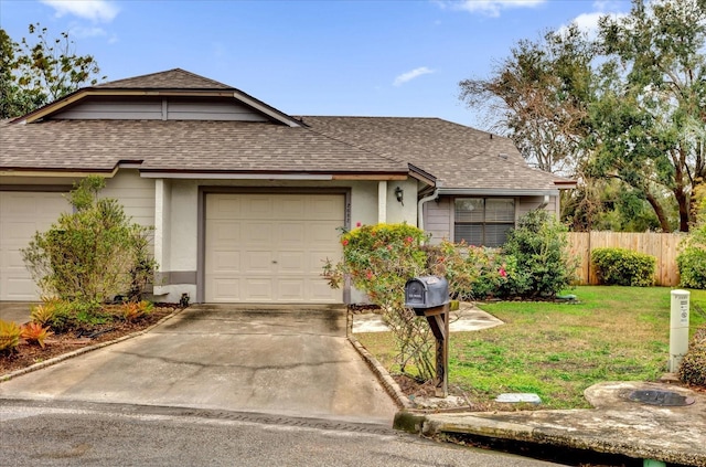 ranch-style house with a garage and a front lawn