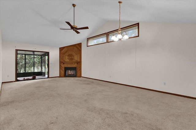 unfurnished living room featuring a large fireplace, carpet flooring, a chandelier, and high vaulted ceiling