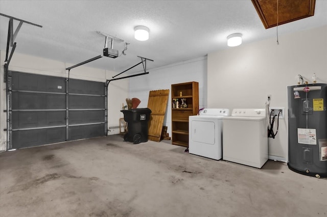 garage featuring a garage door opener, washer and clothes dryer, and water heater