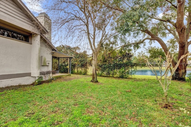 view of yard with a water view