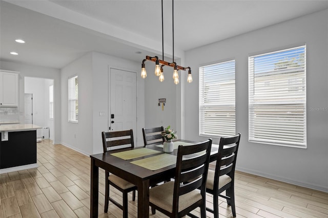 dining area featuring light wood-type flooring