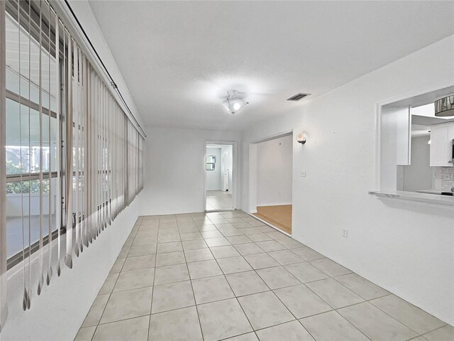 2448 S Daytona Ave, Flagler Beach, FL 32136 - empty room with light tile patterned flooring