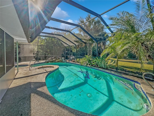 2448 S Daytona Ave, Flagler Beach, FL 32136 - outdoor pool featuring a lanai, a patio area, and an in-ground hot tub
