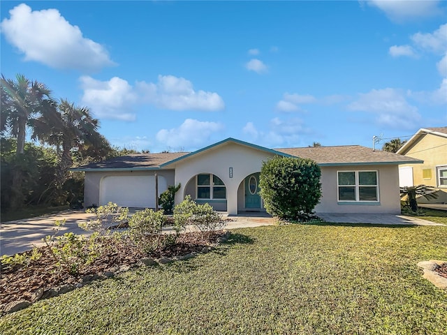 2448 S Daytona Ave, Flagler Beach, FL 32136 - ranch-style house featuring stucco siding, driveway, a front lawn, and an attached garage
