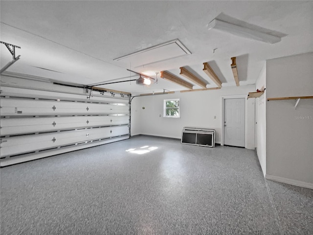 2448 S Daytona Ave, Flagler Beach, FL 32136 - garage with a garage door opener and baseboards