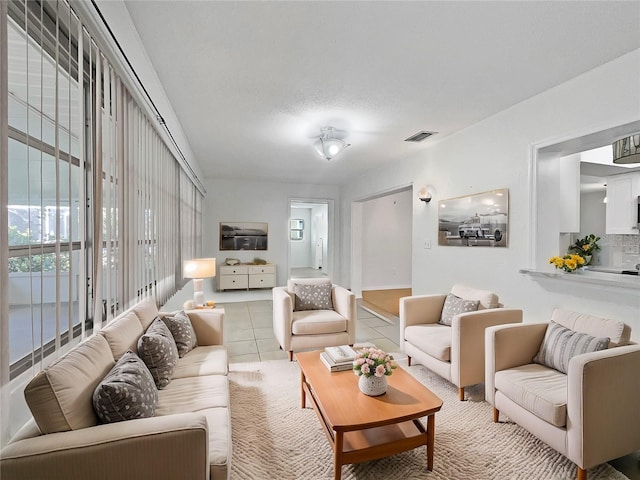 living room with light tile patterned floors