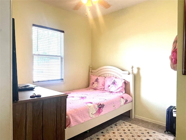 carpeted bedroom featuring ceiling fan