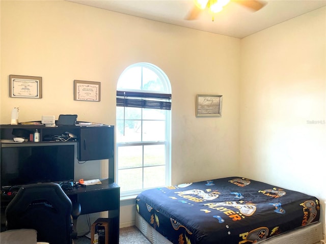 carpeted bedroom with ceiling fan