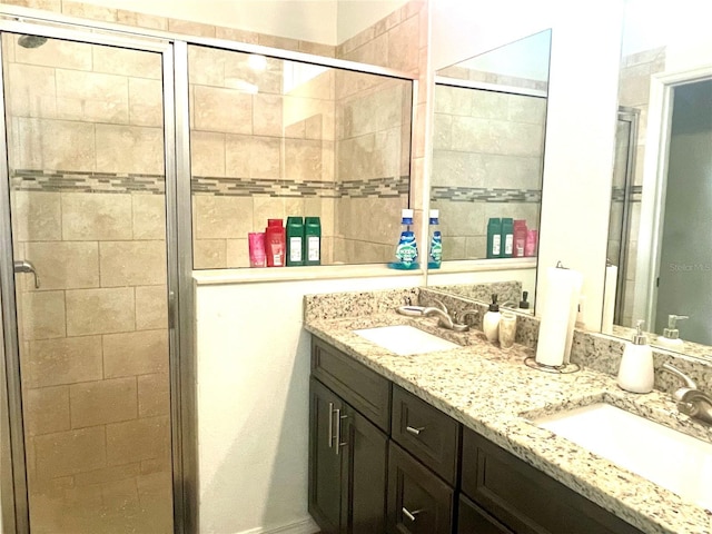 bathroom with vanity and an enclosed shower