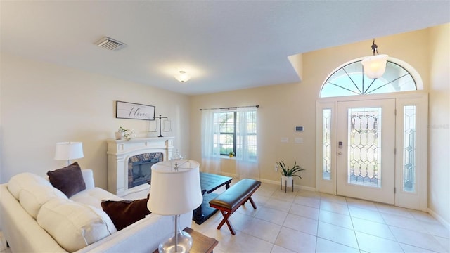 tiled living room with a high end fireplace