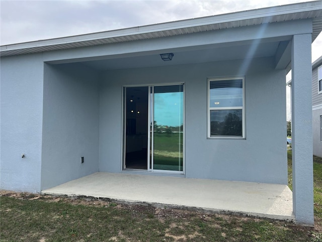 rear view of house featuring a patio area