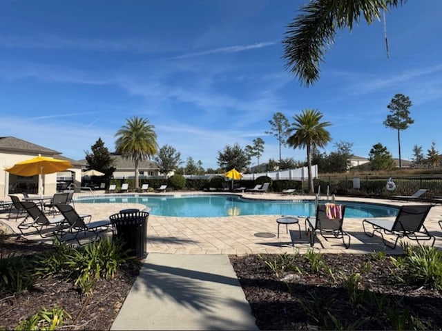 view of swimming pool featuring a patio area