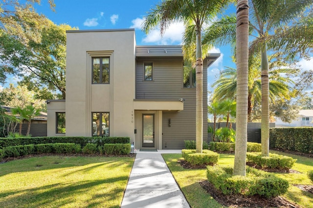 contemporary home featuring a front yard