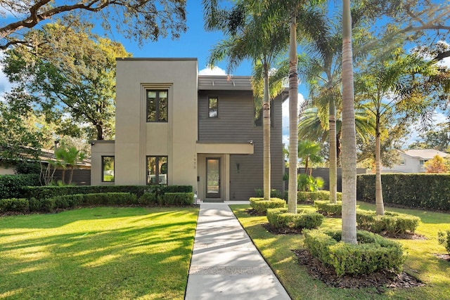 contemporary house featuring a front lawn