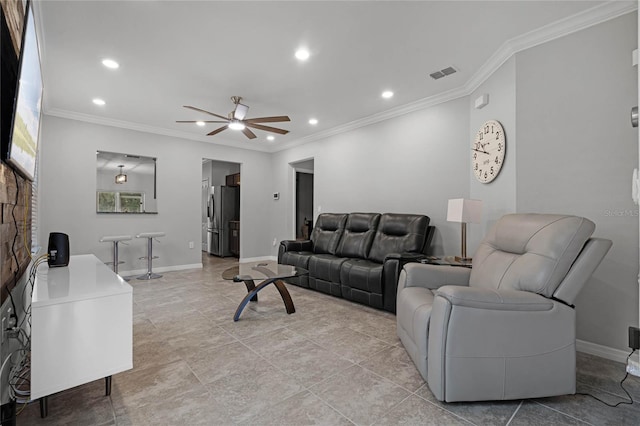 living room with light tile patterned floors, ceiling fan, and ornamental molding