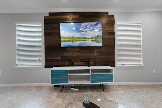 interior details featuring crown molding and wood walls