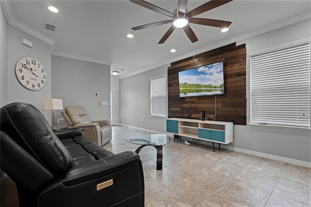 living room with ceiling fan and ornamental molding