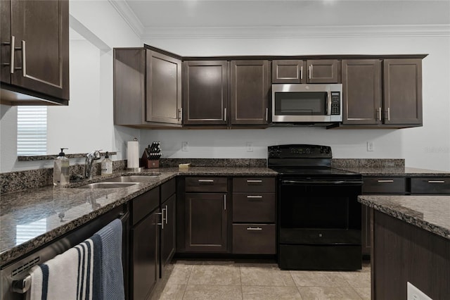 kitchen featuring dark brown cabinets, black range with electric stovetop, sink, and dark stone counters