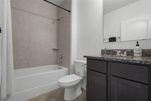 full bathroom featuring tile patterned flooring, vanity, toilet, and tiled shower / bath