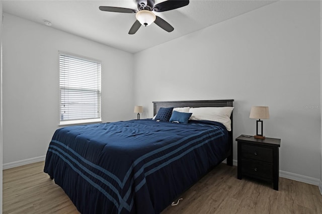 bedroom featuring ceiling fan and wood-type flooring