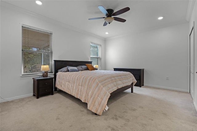 bedroom with light carpet, ceiling fan, and ornamental molding