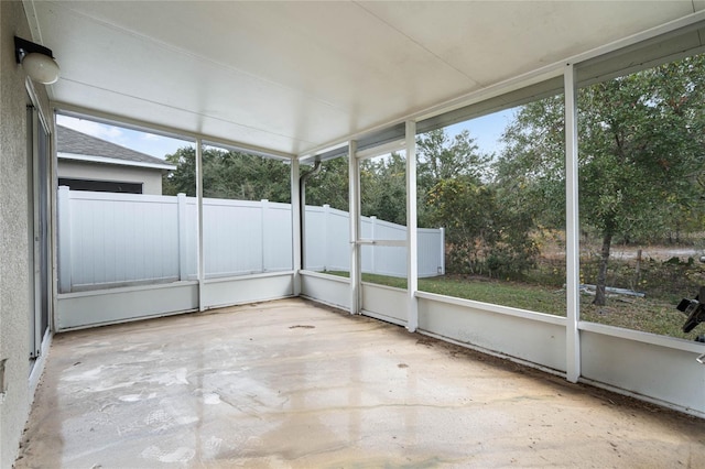 unfurnished sunroom featuring a wealth of natural light