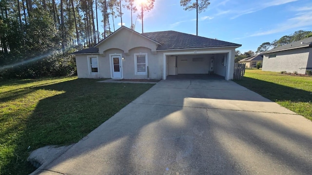 ranch-style home with a garage and a front yard