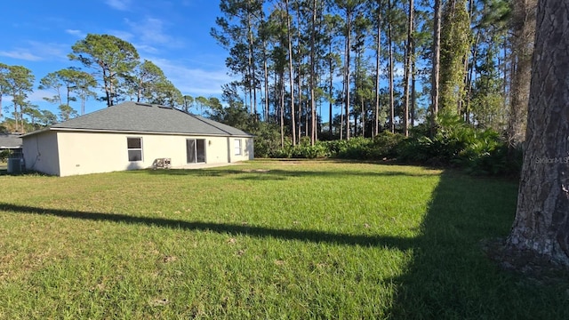 view of yard featuring central AC