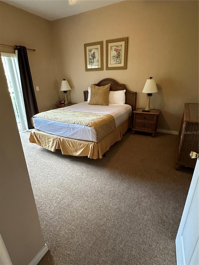 bedroom featuring dark colored carpet