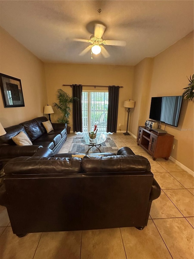 living room with light tile patterned floors and ceiling fan