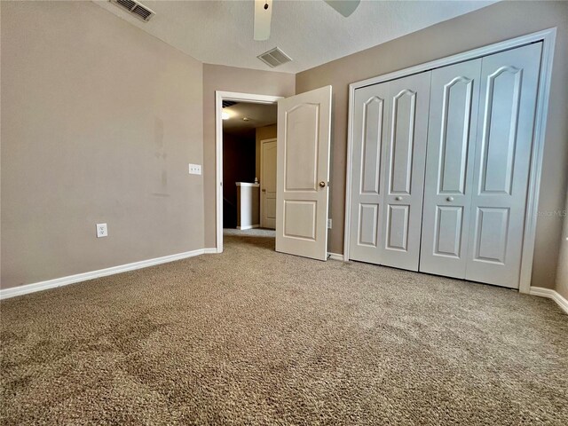 unfurnished bedroom featuring visible vents, baseboards, and light colored carpet