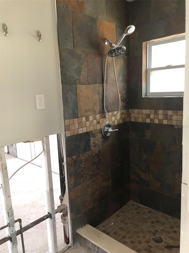 bathroom with tiled shower