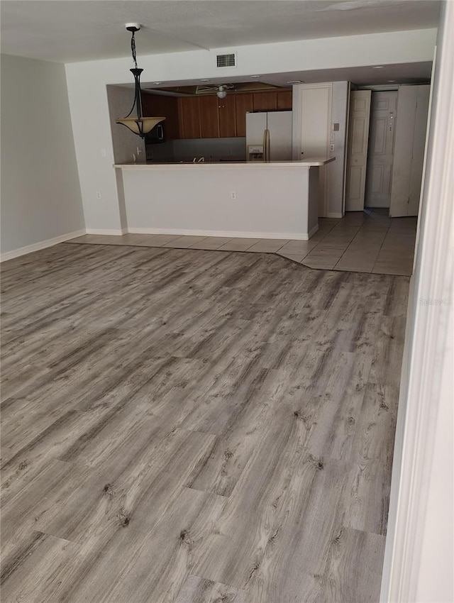 unfurnished living room with light hardwood / wood-style floors