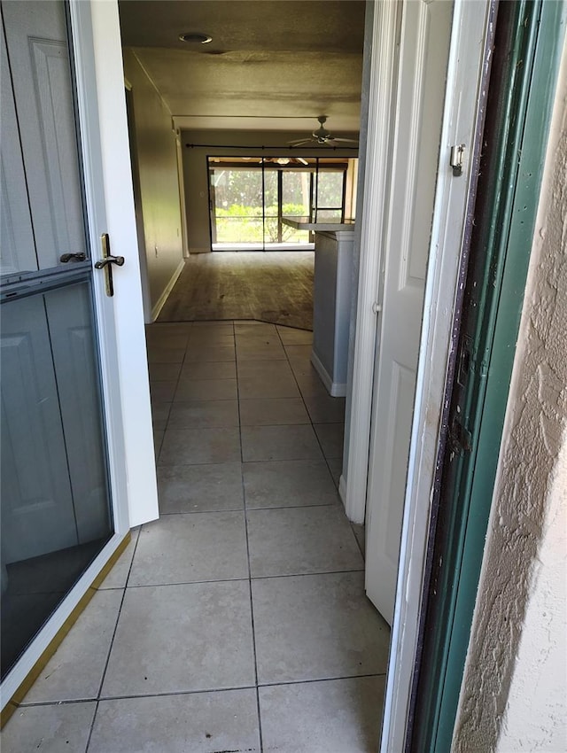 hallway with light tile patterned floors