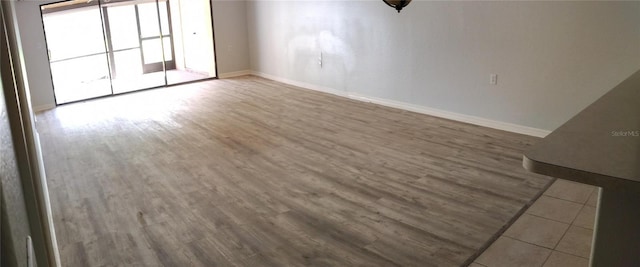 unfurnished room featuring wood-type flooring