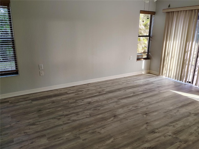 spare room featuring dark hardwood / wood-style flooring