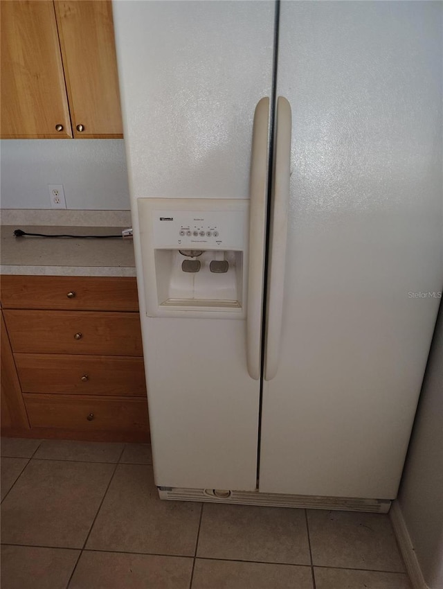 interior details with white refrigerator with ice dispenser