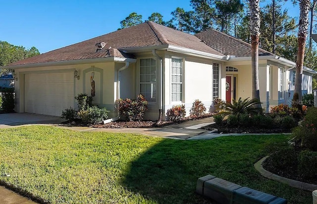 view of front of home featuring a garage and a front yard