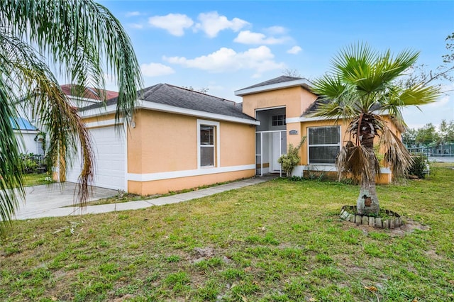 exterior space featuring a lawn and a garage