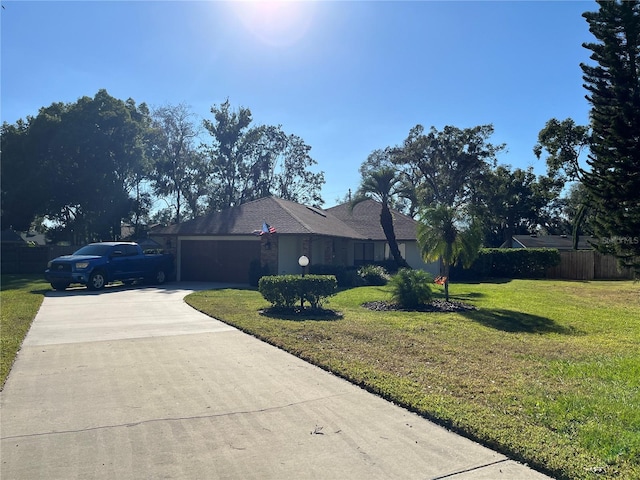 view of side of property with a yard and a garage