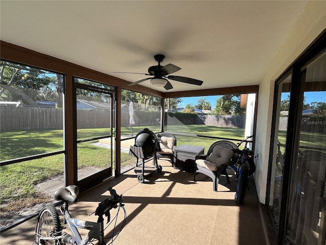 sunroom / solarium with ceiling fan