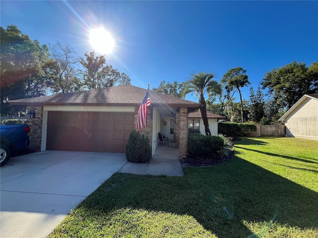 single story home with a front yard and a garage